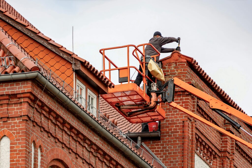 construction worker working on roof